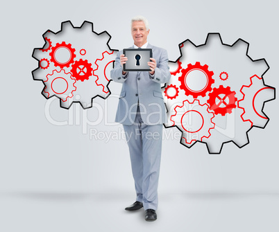 Smiling man in suit holding a tablet