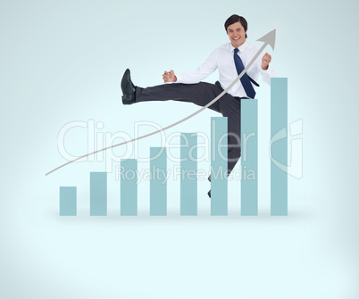 Smiling businessman jumping over the graphical presentation