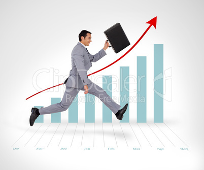 Businessman holding his suitcase running against a graph