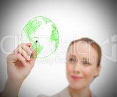 Woman drawing globe with marker