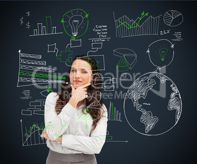 Businesswoman standing against a background looking directly int