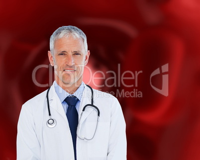 Doctor standing against a red background