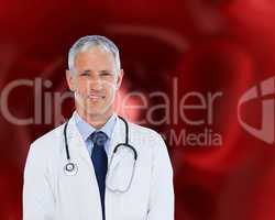 Doctor standing against a red background