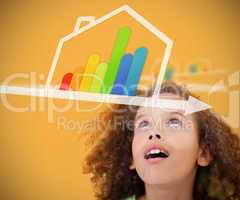 Girl looking up to energy efficient house graphic