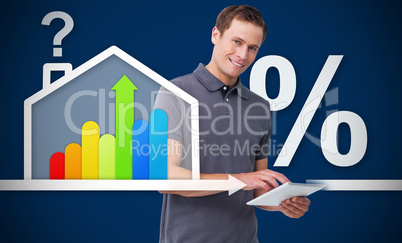 Smiling man working with tablet with energy efficient house grap