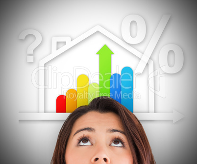 Woman looking up at energy efficient house graphic