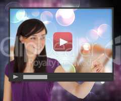 Woman touching screen with video