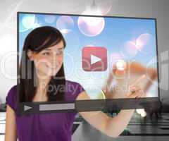 Smiling woman using touch screen
