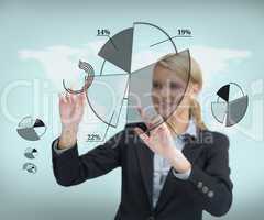 Businesswoman touching screen with graphs