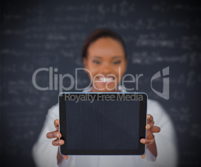 Smiling businesswoman holding a tablet