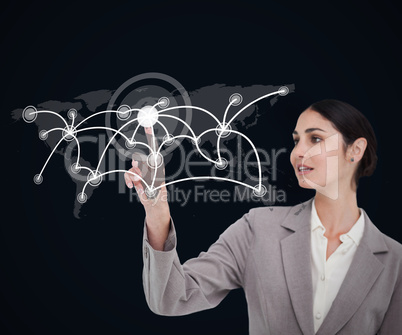 Businesswoman touching screen against a background