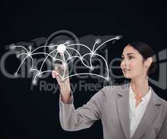 Businesswoman touching screen against a background