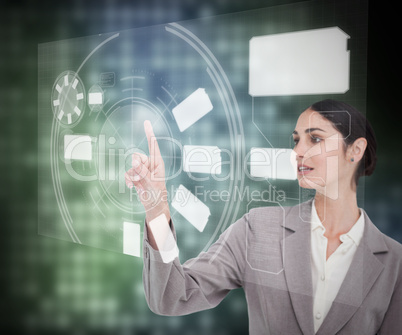 Brunette businesswoman touching the screen