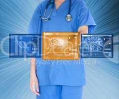 Doctor using touchscreen against blue background