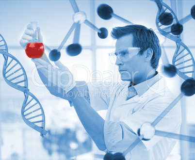 Scientist examining a beaker