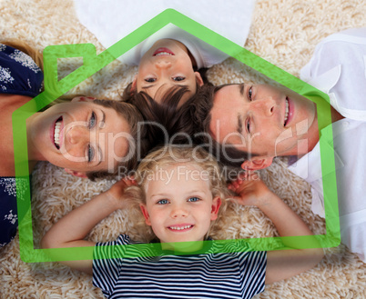 Smiling young family in front of green house illustration