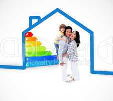 Smiling family standing with a blue house illustration with ener
