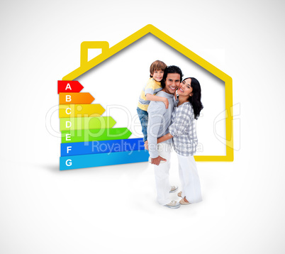 Smiling family standing with a yellow house illustration with en