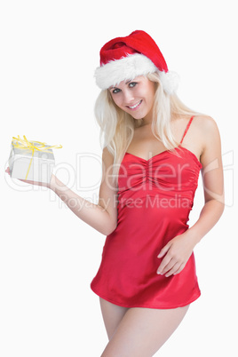 Happy woman holding christmas gift