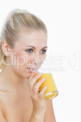 Young woman drinking orange juice