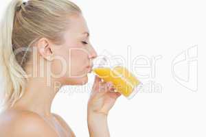 Beautiful woman drinking orange juice