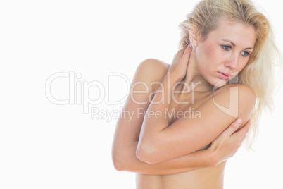 Sensuous female hugging self