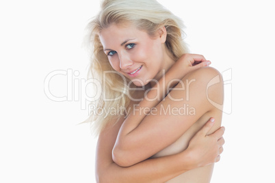 Happy woman hugging herself