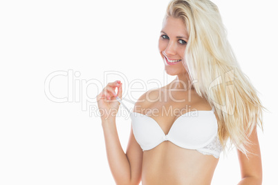 Sexy woman pulling off bra strap