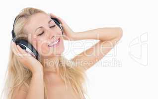 Relaxed woman enjoying music