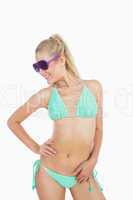 Happy woman in bikini wearing sunglasses