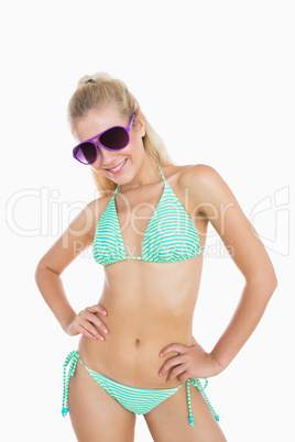 Sexy woman in bikini wearing sunglasses