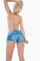 Topless woman in hot pants