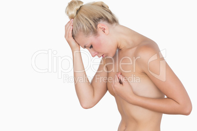 Sad woman covering her breast