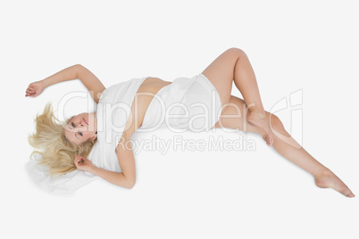 Woman wrapped in cloth lying on floor