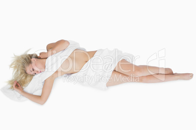 Woman wrapped in cloth relaxing on floor