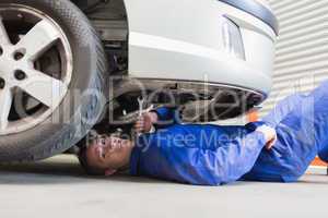 Auto mechanic under car