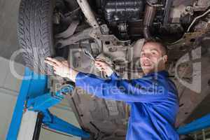 Mechanic repairing car