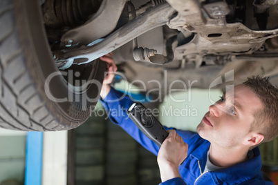 Mechanic examining tire