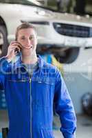 Smiling male mechanic on call