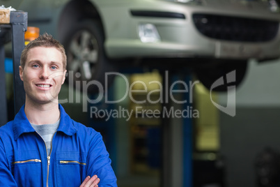 Confident male auto mechanic