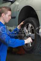 Mechanic changing car tyre