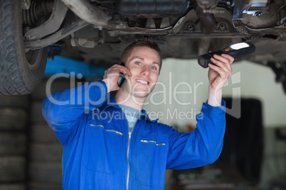 Car Mechanic using cell phone