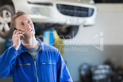 Mechanic using mobile phone