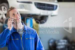 Mechanic using mobile phone