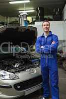 Happy mechanic by breakdown car