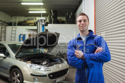 Confident male mechanic with spanner