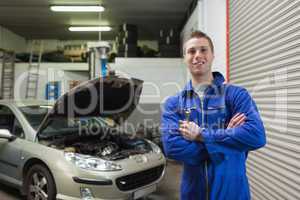 Confident male mechanic with spanner