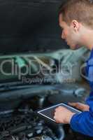 Mechanic using digital tablet