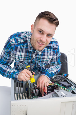 Portrait of computer engineer repairing cpu