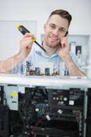 Computer engineer working on cpu part in front of open cpu